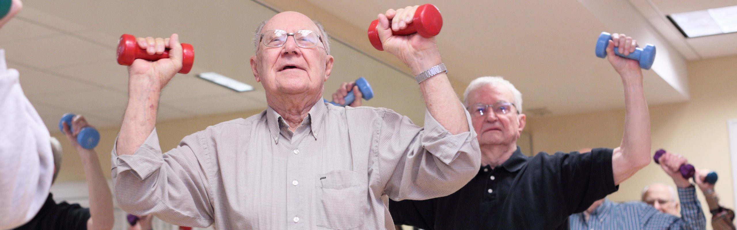 Brio Living Services, Residents Lifting Weights in Aerobics Class